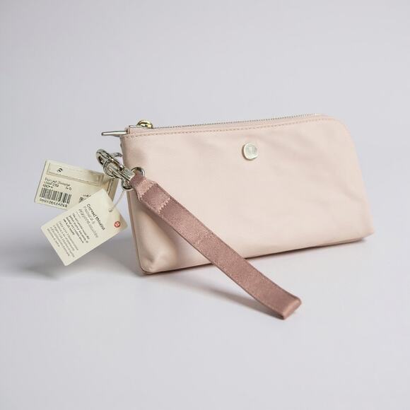 Lululemon Handbags - Lululemon Curved Wristlet Clutch W9FZ4S in MEPK Meadowsweet Pink NWT